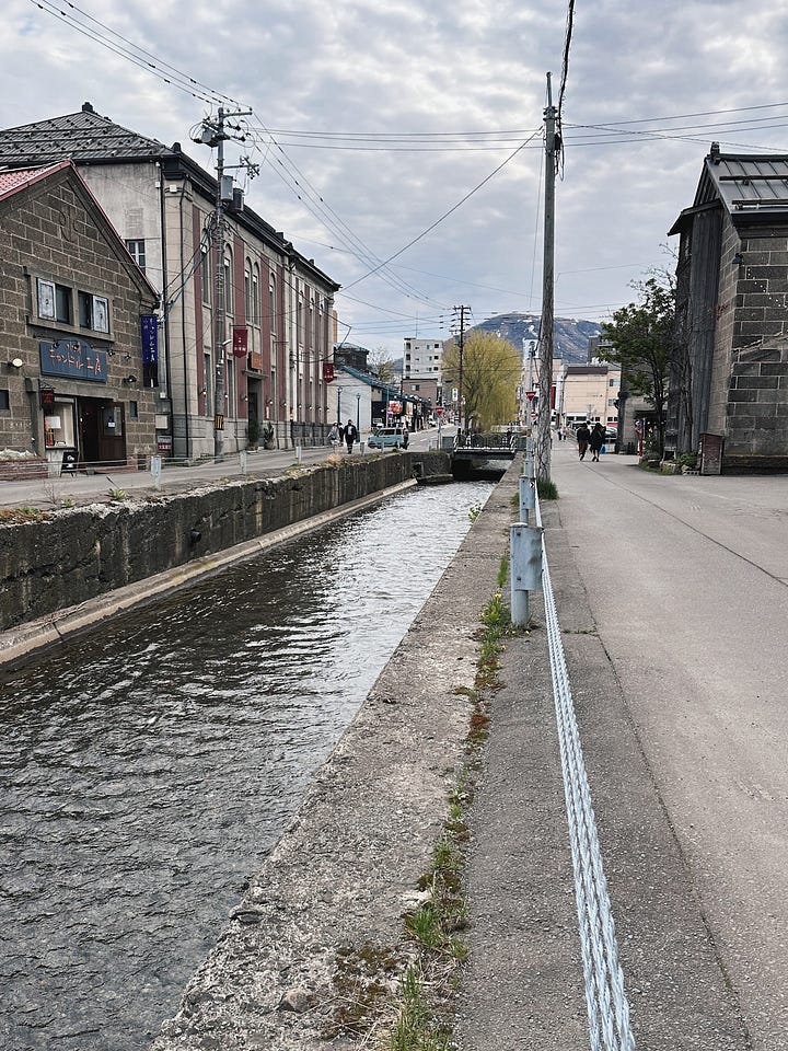 Scenes from Otaru, including a bowl of Hokkaido crab, the historic canal, handblown glassware, and the Otaru Music Box Museum