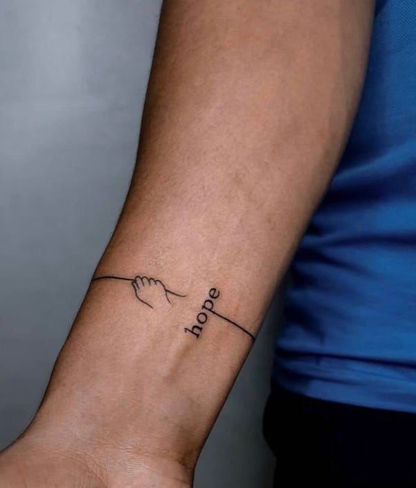 Hope tattoo on the hand showcasing the compromises are necessary