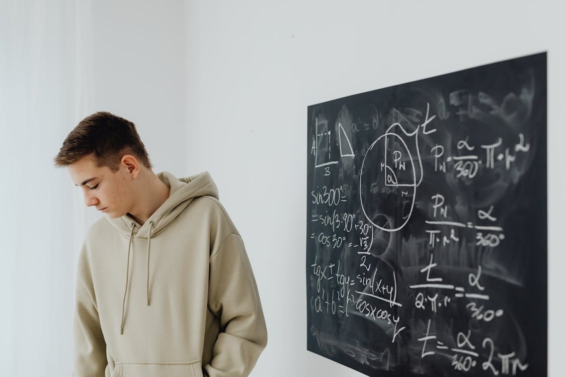 Free Boy in Beige Hoodie Looking Disappointed Stock Photo