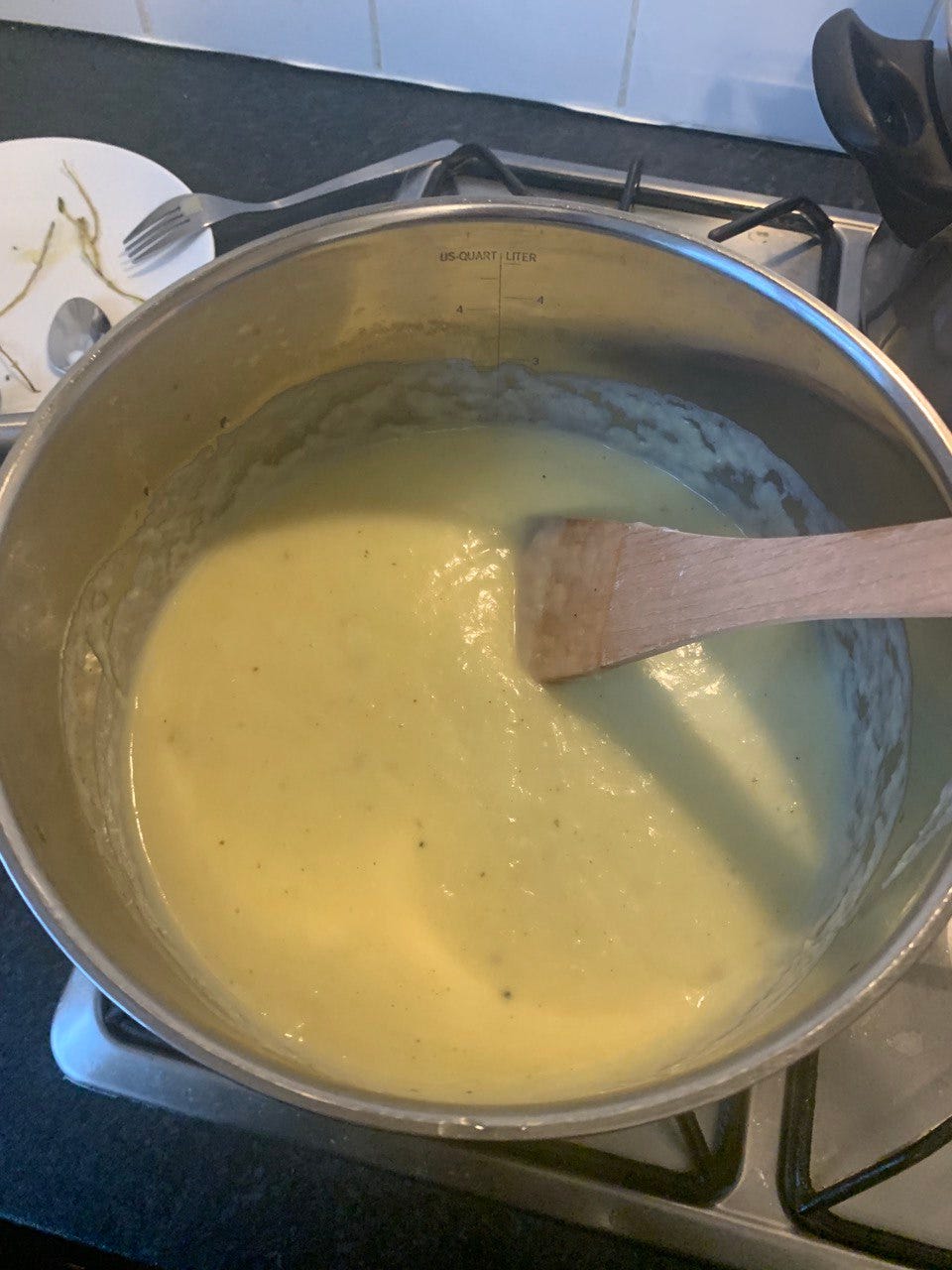 Potato and leek soup in a pot, post-blend