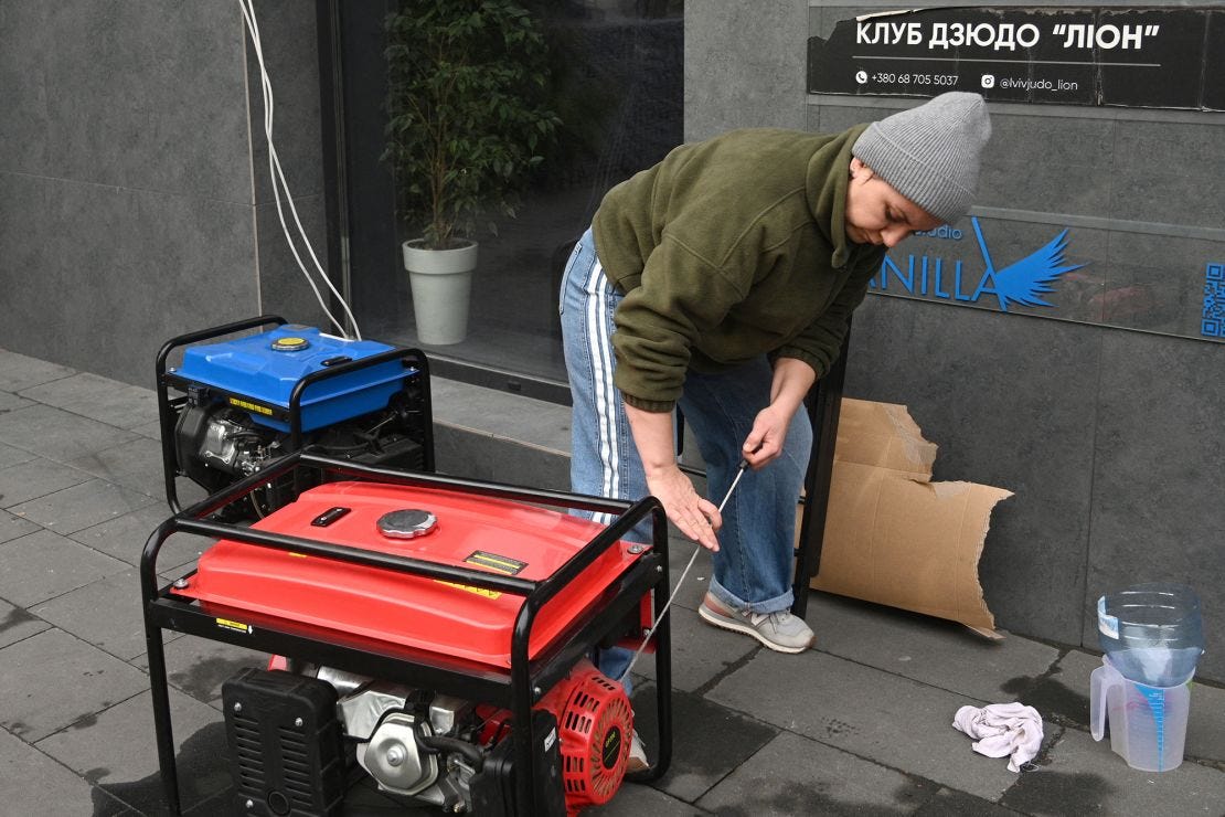 A local resident starts a generator during a power outage in Lviv following Russia's aerial attacks. A local resident starts a generator during a power outage in Lviv following Russia's aerial attacks.