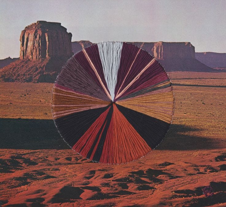 This may contain: an image of a red, white and blue color wheel in the middle of desert