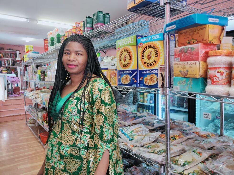 Fati Lafia Soumaila sells African textiles and food products in her small Africatown shop. Fati Lafia Soumaila sells African textiles and food products in her small Africatown shop.