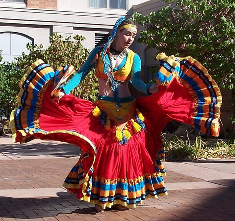 Immense skirts whorl, ripple, and pop in turquoise and yellow, and red with a five-tier hem.