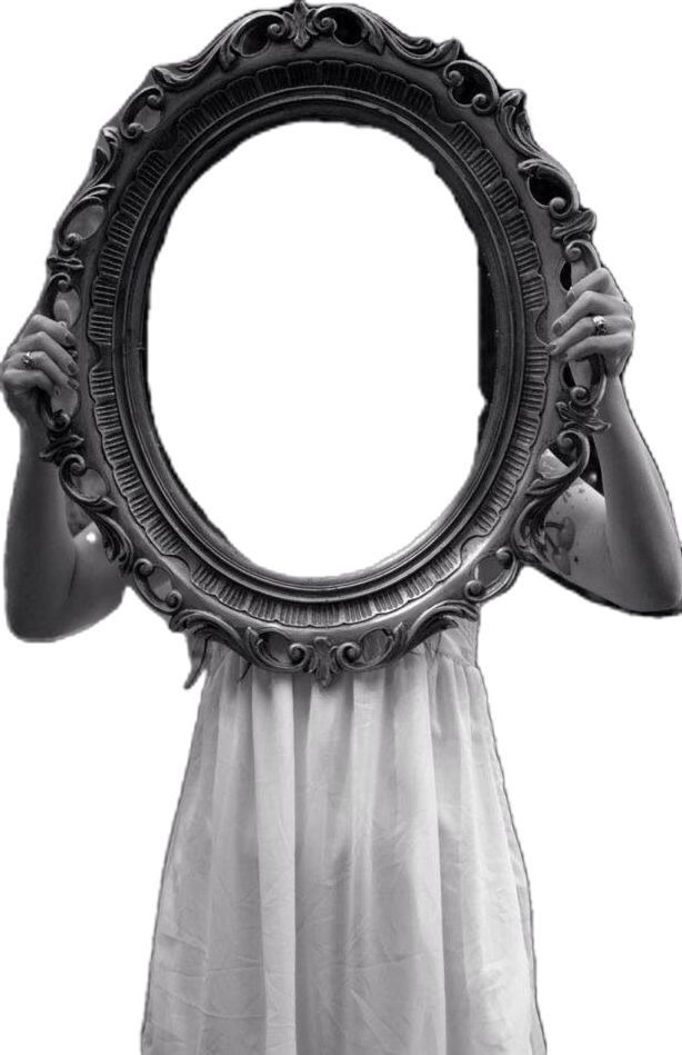 This may contain: a woman holding up a mirror to her face This may contain: a woman holding up a mirror to her face