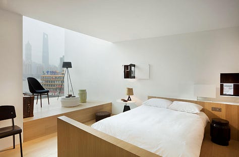 Neri&Hu — The Waterhouse at South Bund, Shanghai. Former 1930s Japanese army headquarters converted into a boutique hotel. Raw concrete, preserved industrial structure, and original markings held deliberately as identity rather than erased.