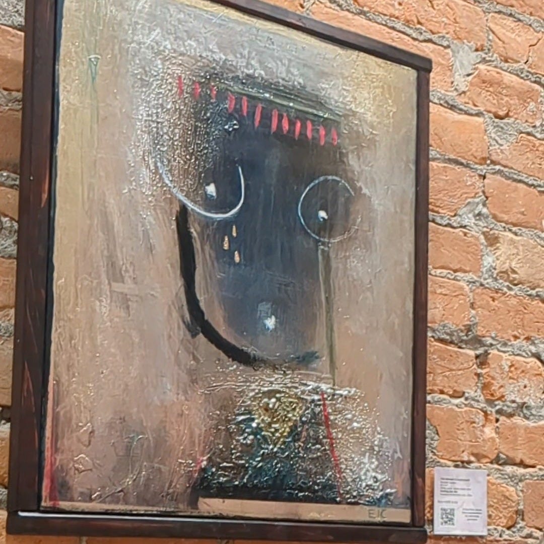 Art display from the fundraiser art auction where I administered a survey about perception of periods. Artistic painting of a women's chest. 