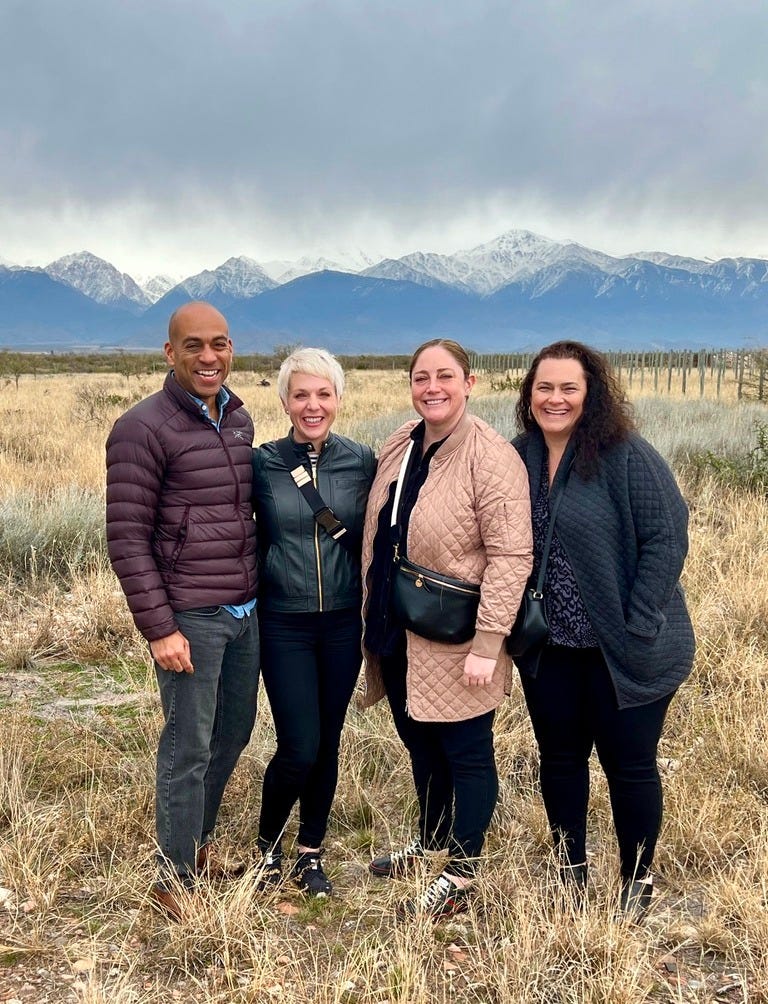 Kat Saks and friends standing on their Argentine vineyard land