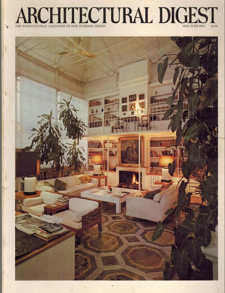 This may contain: the front page of an architectural digest with furniture and bookshelves on display in it