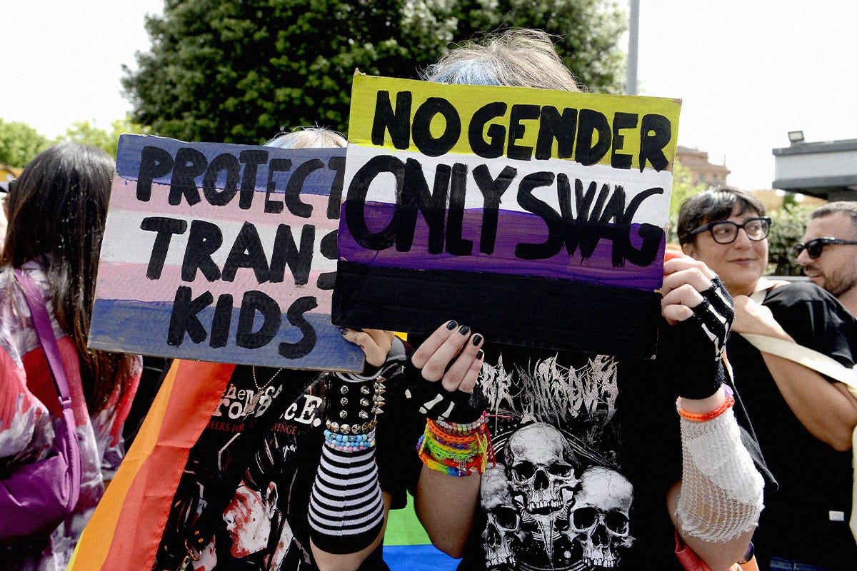 People with LGBTQ+ flags and placards participate in the Demonstration on the occasion of the international day against homophobia, biphobia and transphobia for the self-determination of trans, intersex and non-binary people, against institutional violence, on May 18, 2024 in Rome, Italy. People with LGBTQ+ flags and placards participate in the Demonstration on the occasion of the international day against homophobia, biphobia and transphobia for the self-determination of trans, intersex and non-binary people, against institutional violence, on May 18, 2024 in Rome, Italy.