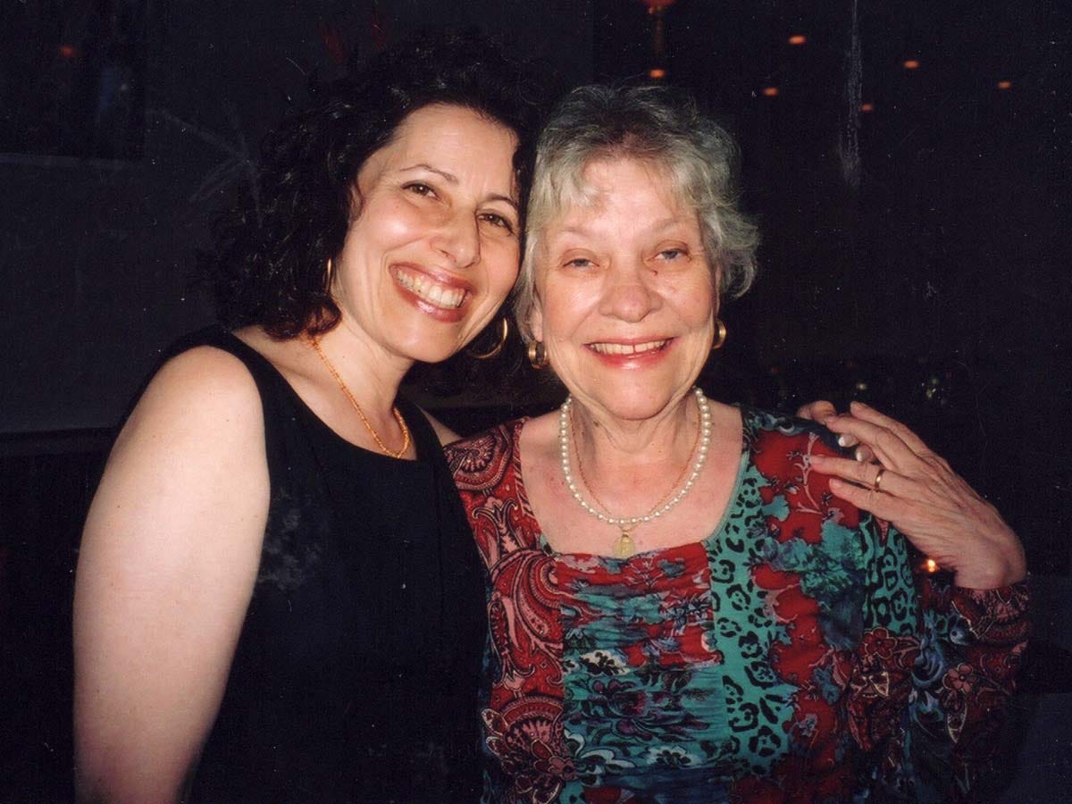 Lesléa and Patricia MacLachlan smiling with their arms around each other
