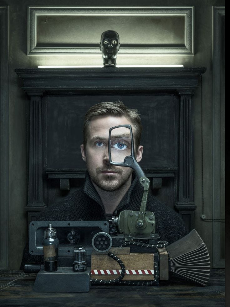 This may contain: a man looking through a magnifying glass at an antique camera and other items