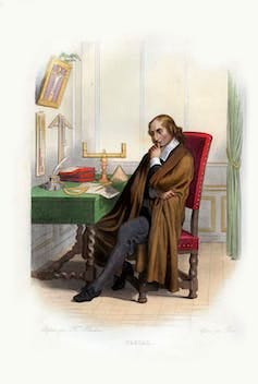Illustration of a man in seventeenth century clothing, sitting at a desk, looking at mathematical Illustration of a man in seventeenth century clothing, sitting at a desk, looking at mathematical