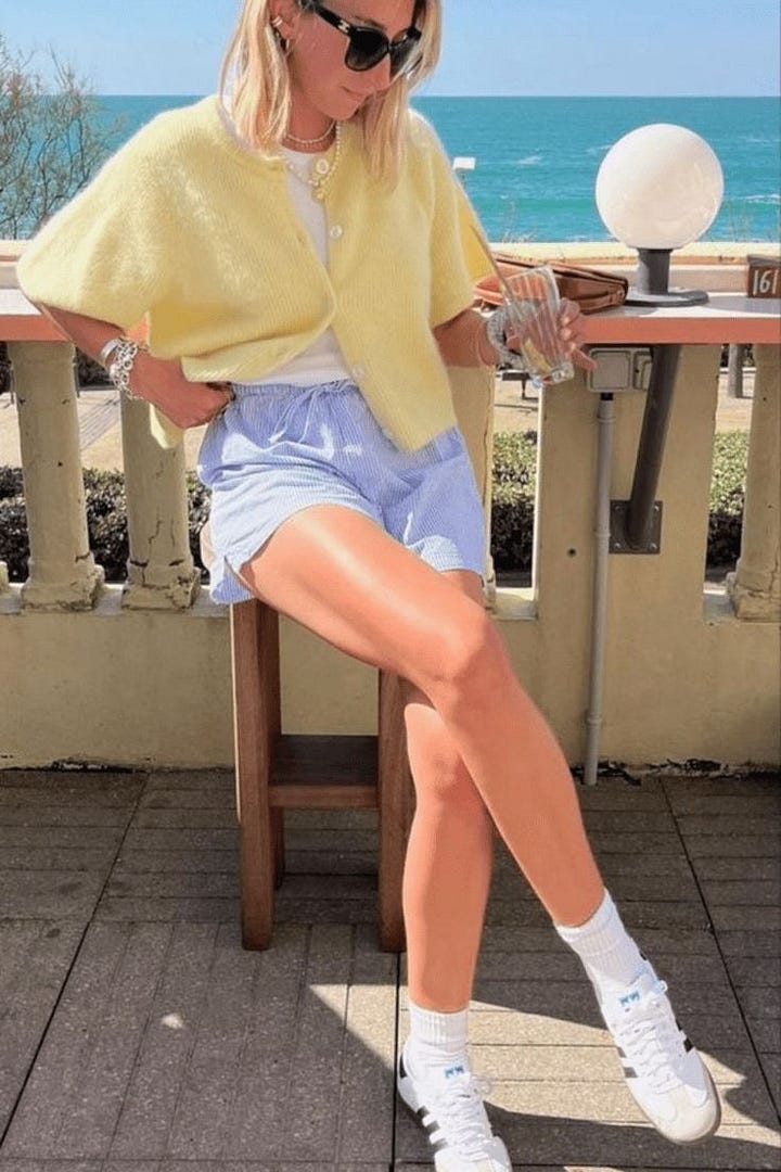 people wearing blue and white shorts with red and yellow tops