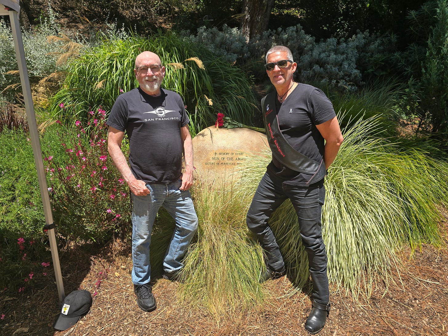 Race Bannon and Aaron Baldwin in front of the Sisters of Perpetual Indulgence memorial boulder in the National AIDS Memorial Grove in San Francisco. Race Bannon and Aaron Baldwin in front of the Sisters of Perpetual Indulgence memorial boulder in the National AIDS Memorial Grove in San Francisco.