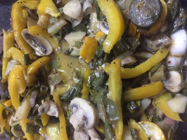 Vegetables baked including capsicum, mushroom, spring onions, potatoes, zucchini Vegetables baked including capsicum, mushroom, spring onions, potatoes, zucchini
