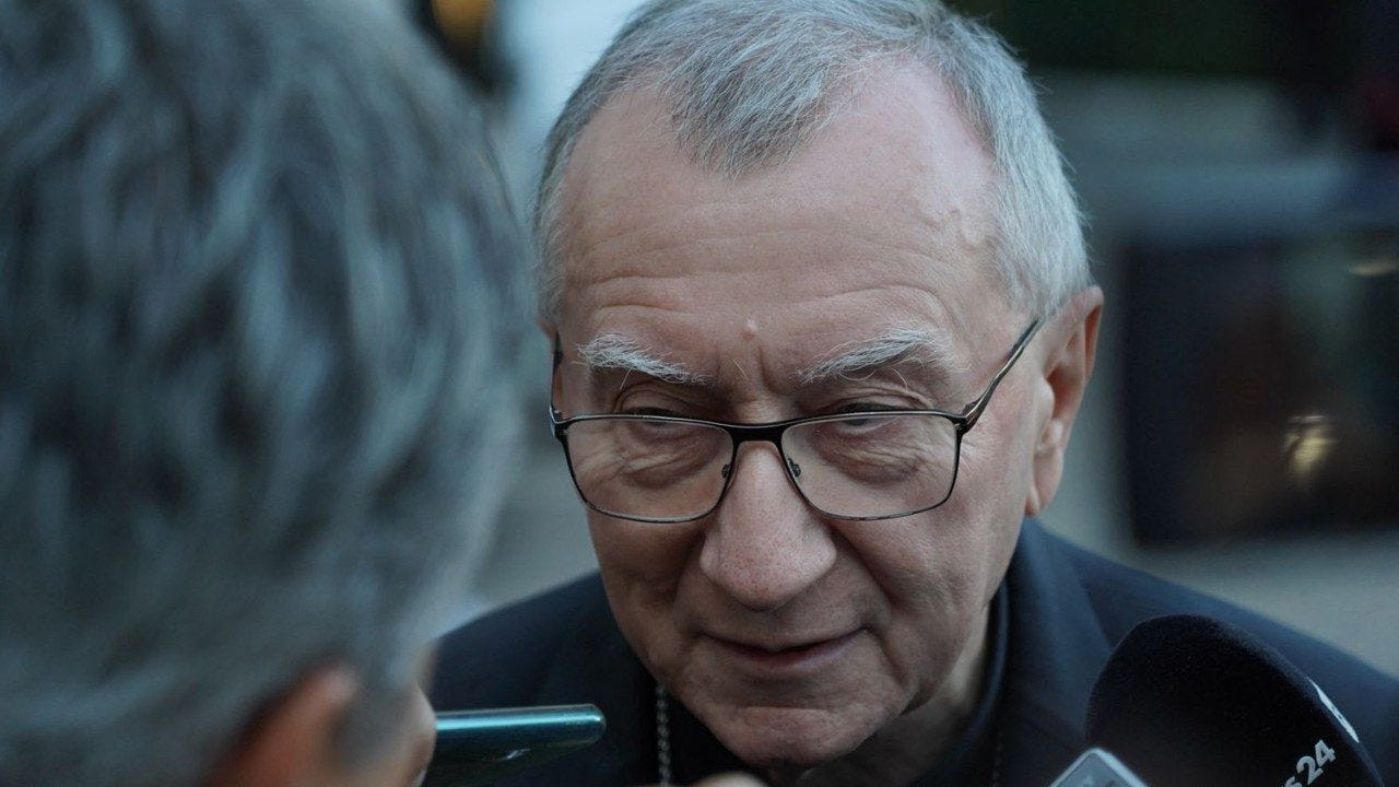 Cardinal Pietro Parolin speaks with reporters