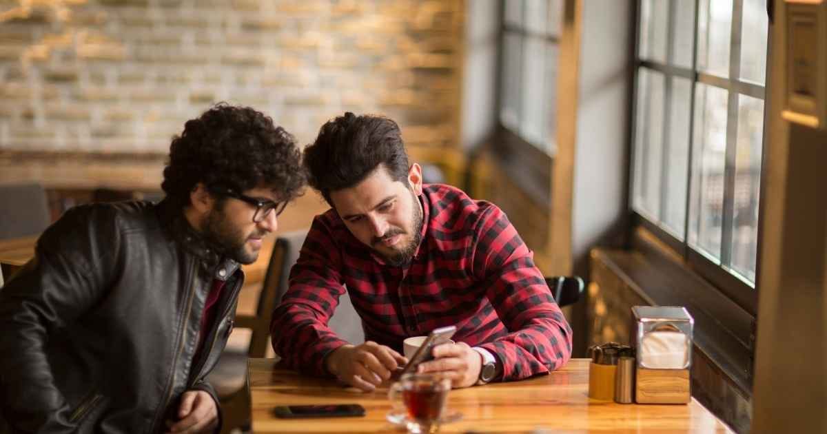 Two friends talking in a cafe Two friends talking in a cafe