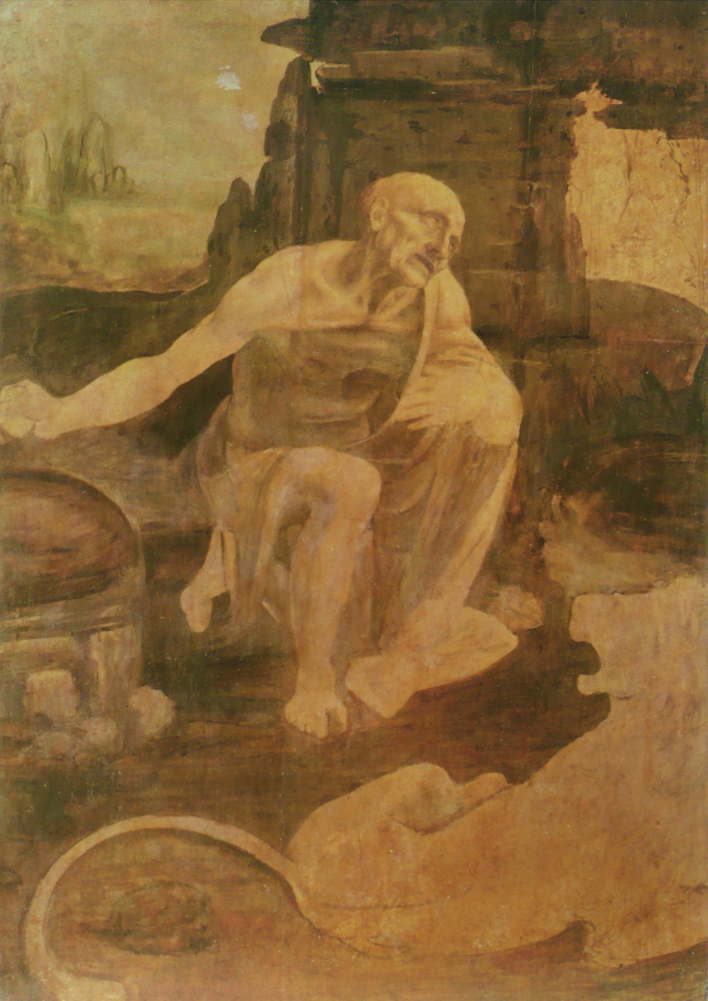 A gaunt old saint kneels in prayer before a cave in a rocky landscape, a tame lion lying in front of him, and much of the panel is still brown underdrawing.