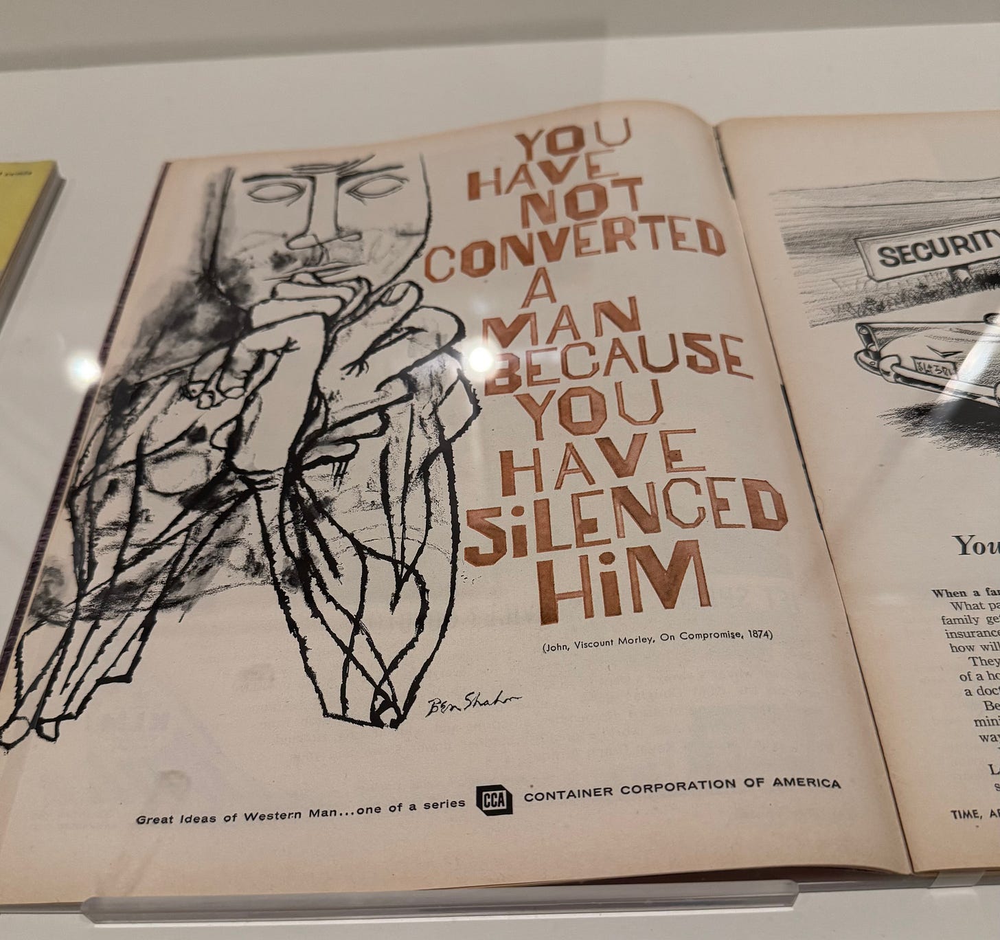 Book open on a display counter. Image of man outlined in black ink the words "You have not converted a man because you have silenced him.