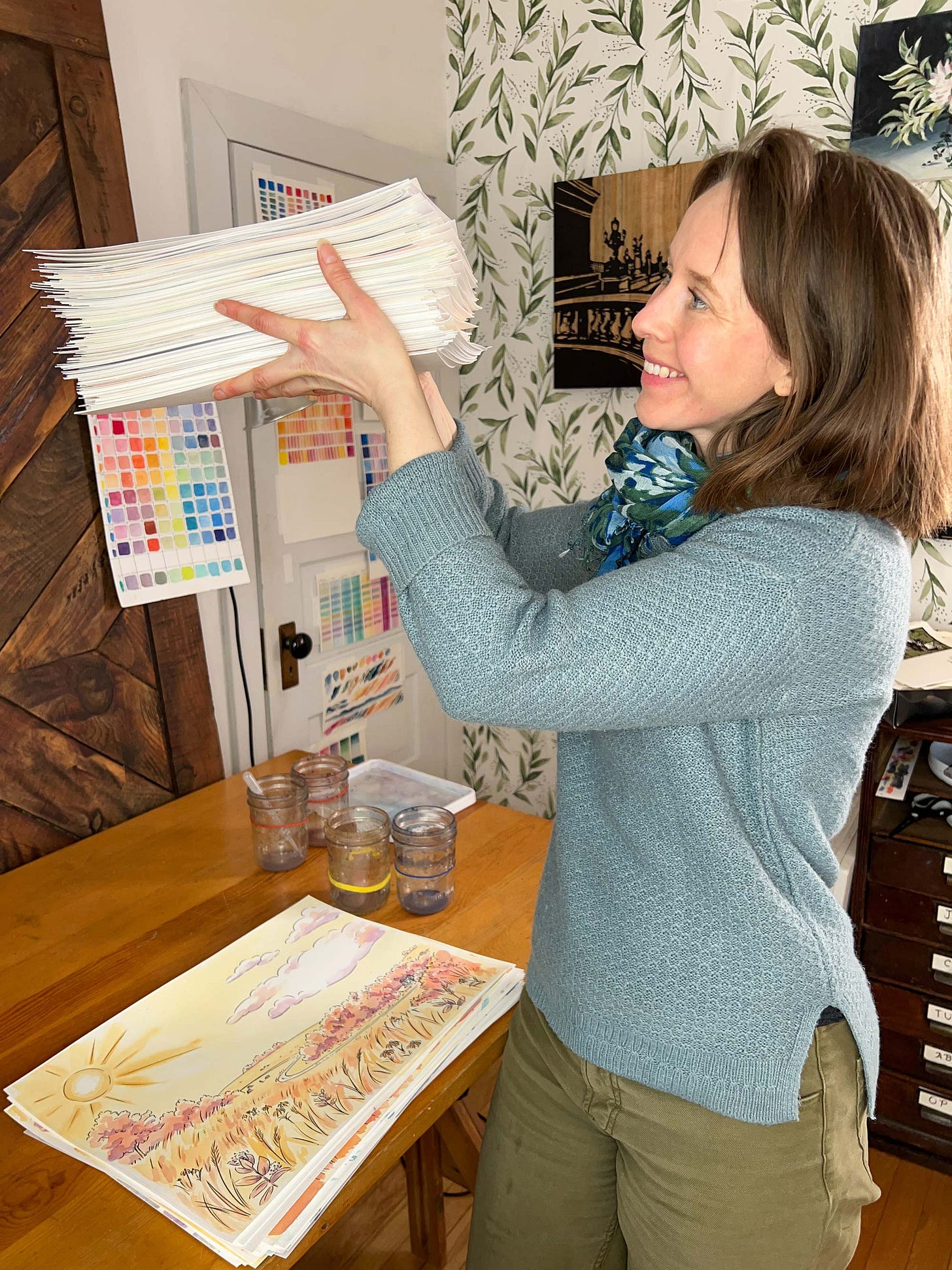 K. Woodman-Maynard is holding all of the final pages of her graphic novel adaptation of Tuck Everlasting.