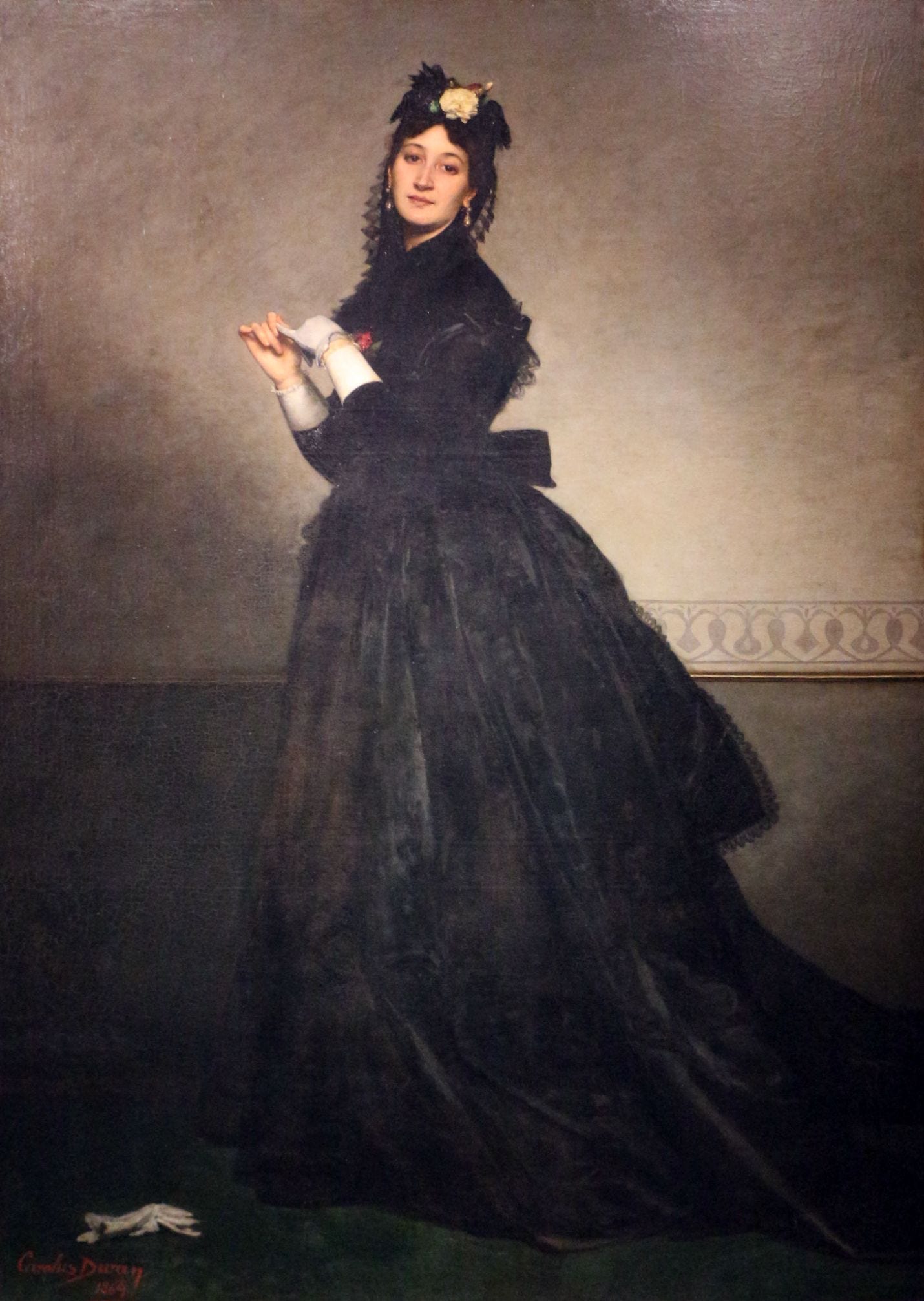 Lady with the Glove by Carolus-Duran: a woman in a long black gown pulls off a gray glove, its pair on the floor Lady with the Glove by Carolus-Duran: a woman in a long black gown pulls off a gray glove, its pair on the floor