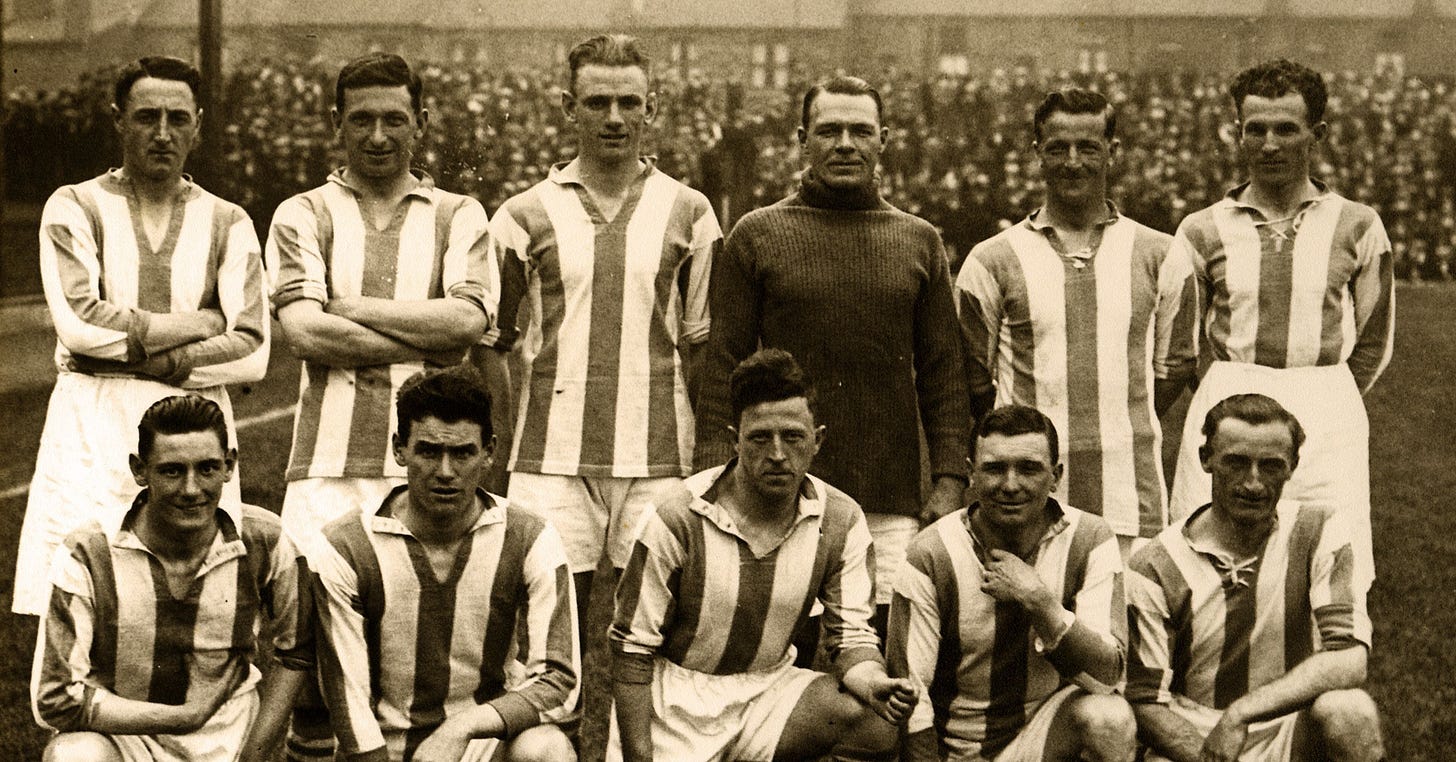 A photograph of Huddersfield Town’s 1925/26 side posing for a team photograph on the pitch at Leeds Road.
