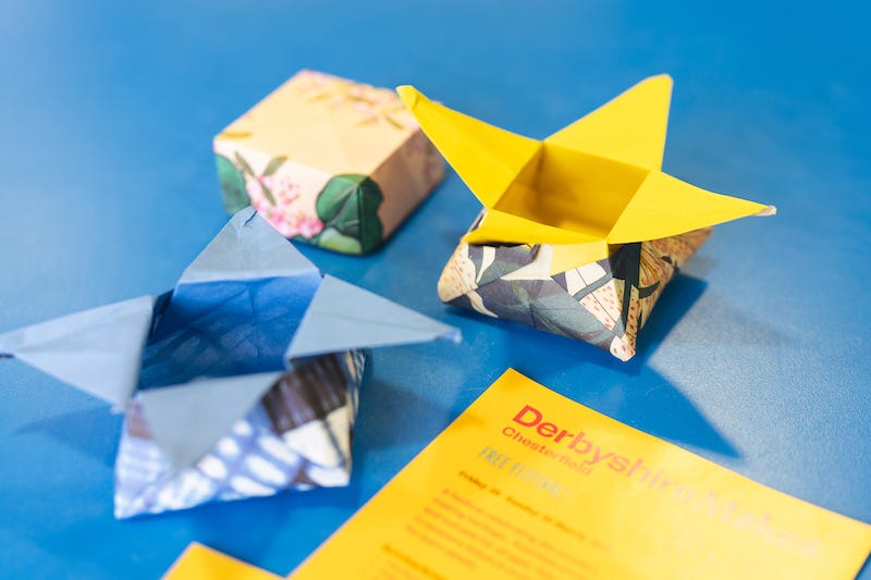 Three handmade small boxes made out of patterned paper