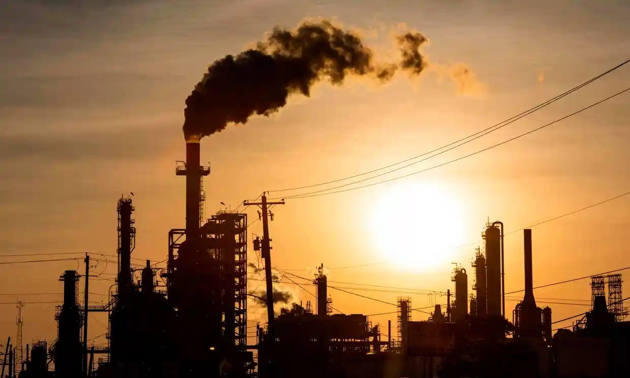 A silhouetted image of fossil fuel production.