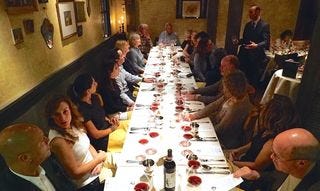 One of the four tables hosting 44 dinner guests One of the four tables hosting 44 dinner guests