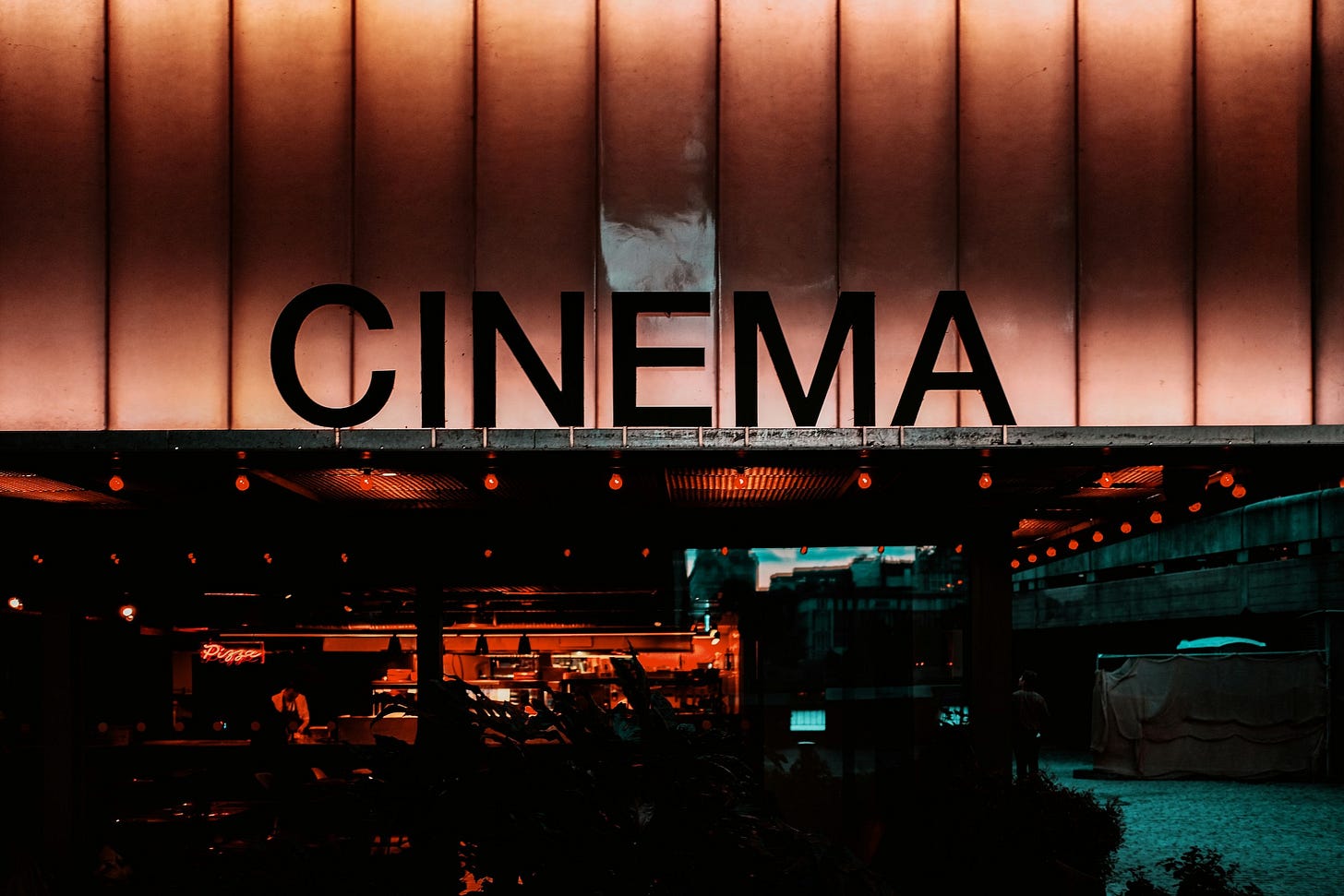 Exterior of cinema at night.