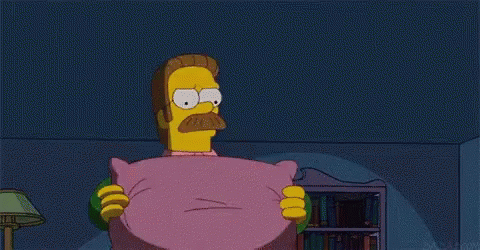 a cartoon character with a mustache is holding a pink pillow . a cartoon character with a mustache is holding a pink pillow .