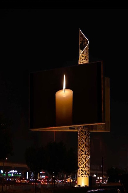 A large rectangular sign with a lit candle

AI-generated content may be incorrect.