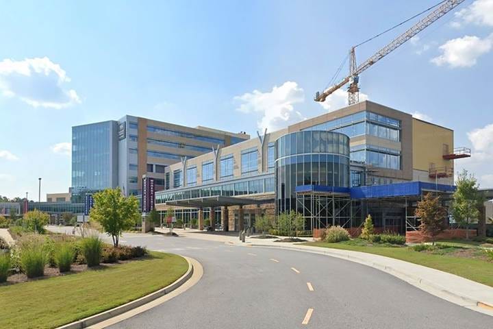 A picture containing text, sky, grass, road

Description automatically generated