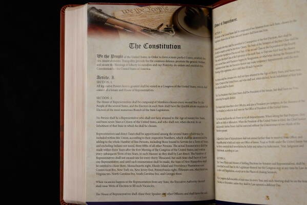 The Constitution of the United States is printed in Republican presidential nominee former President Donald Trump's "God Bless the USA" Bible in Washington, Oct. 8, 2024. (AP Photo/Ben Curtis, File)