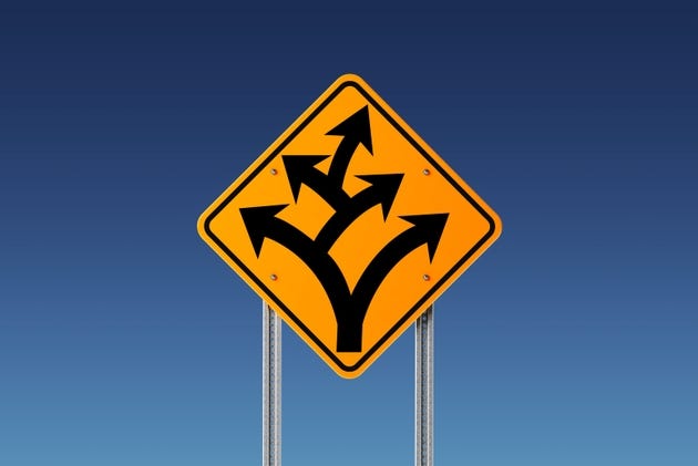 Yellow Branching Off or Division Ahead Traffic Sign on Blue Sky