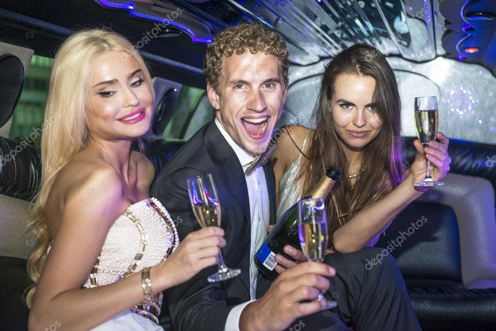 Rich people drinking champagne in a limousine — Stock Photo © Corepics  #125219038