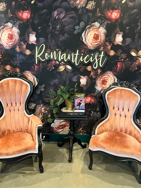 left: exterior of All the Tropes; center: interior with two fancy chairs and my book propped in between; right: Kate holding up a board with sentence strips on it while I look on