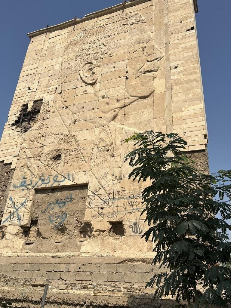 A stone building with a face carved on it

AI-generated content may be incorrect.