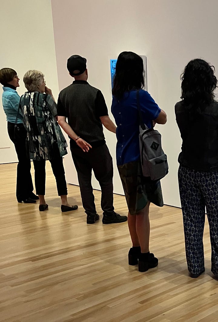 Visitors standing mesmerized by Refik Anadol's Machine Hallucinations - Study 1