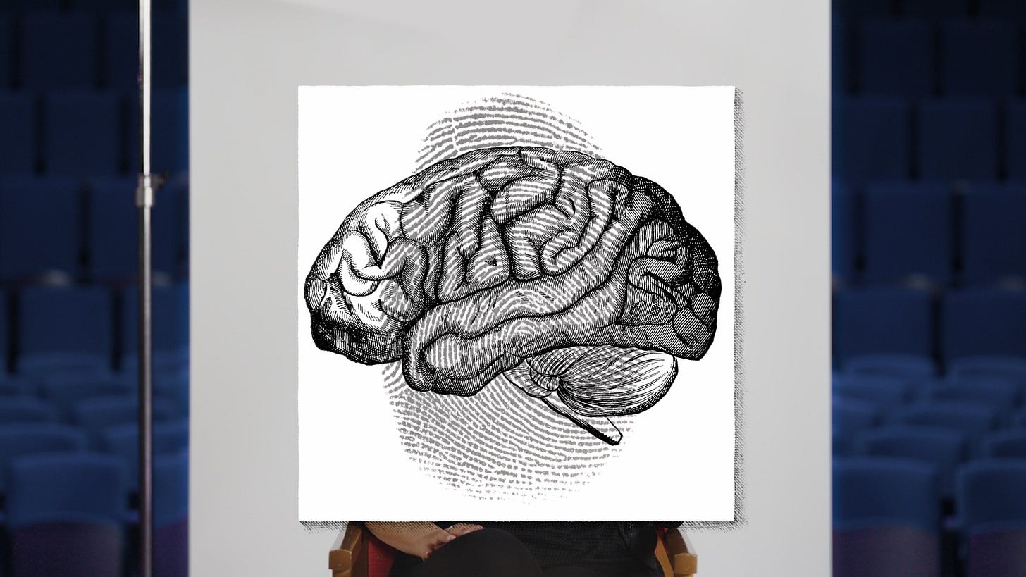 A poster with a drawing of a brain in front of an auditorium.