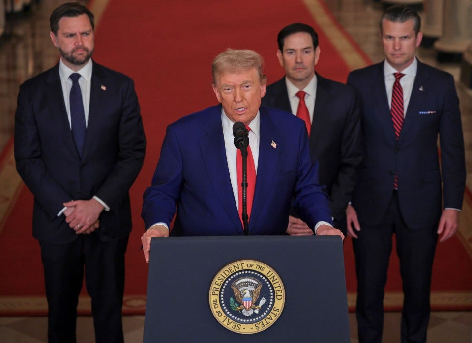 President Trump addressing the press with three other men.