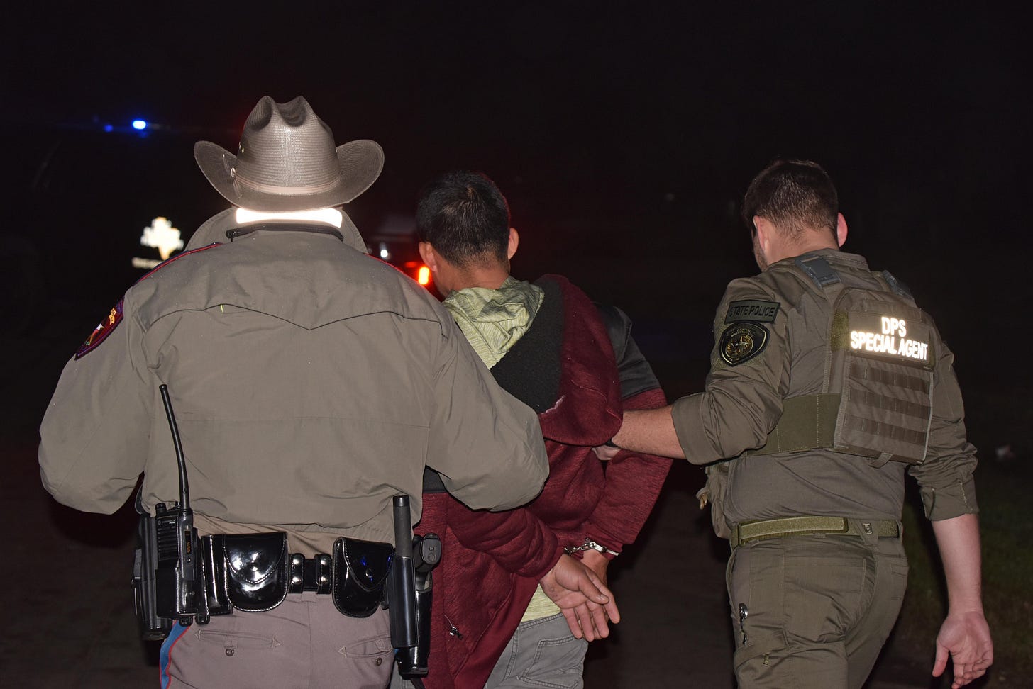 Texas State Police Officers arrest a suspected "criminal alien" during a weeklong multi-agency sweep of the Houston area.