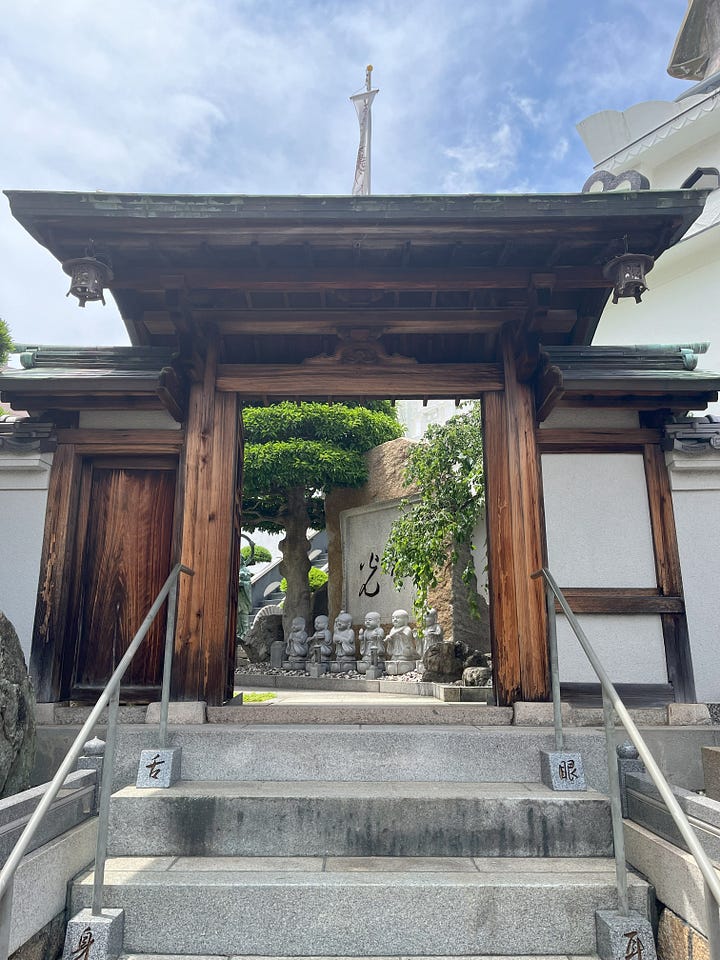 A picture of a shipping container cafe, and a temple entrance with stone statues visible through the gate