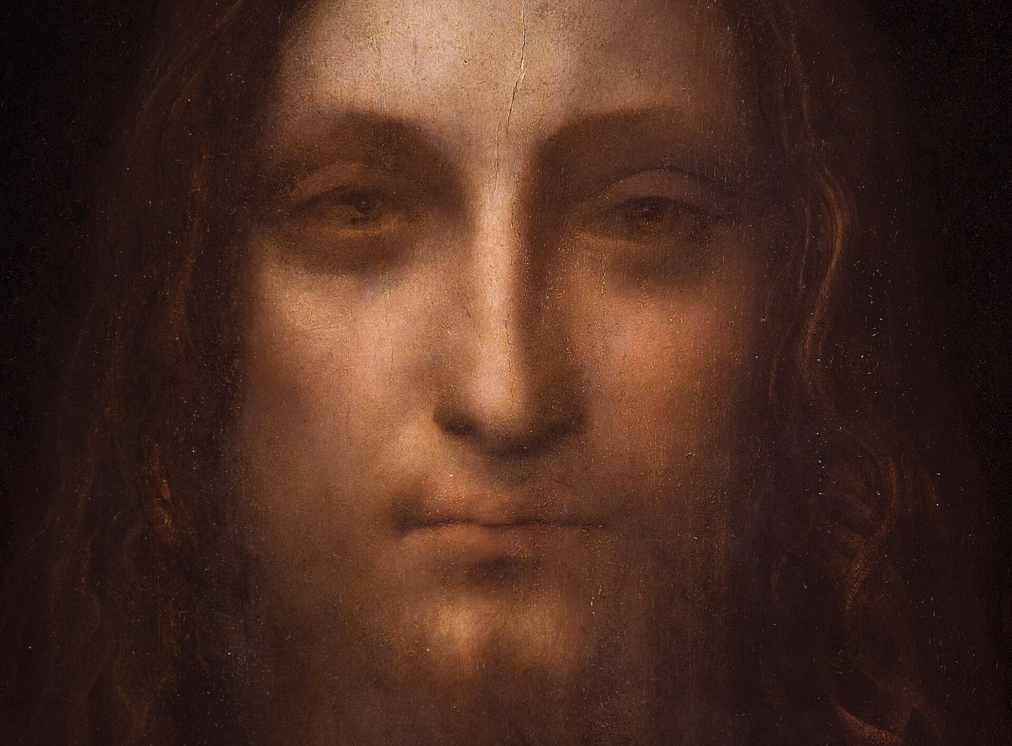 Attributed to Leonardo da Vinci, Salvator Mundi, detail of the face, c. 1500. Attributed to Leonardo da Vinci, Salvator Mundi, detail of the face, c. 1500.