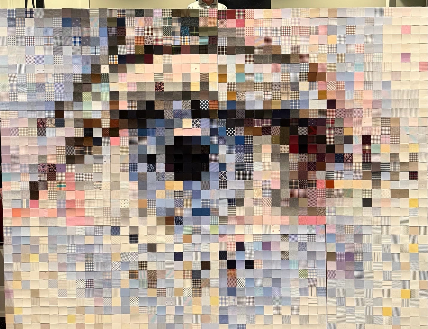 A large wall with a picture of a person's eye

AI-generated content may be incorrect.