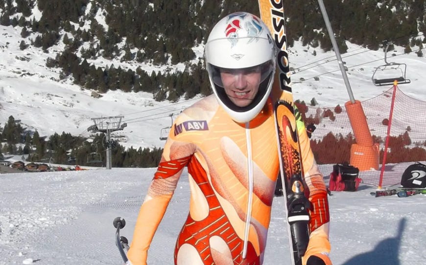 Silvano Meli former Swiss ski world record holder on a snowy mountain slope holding skis