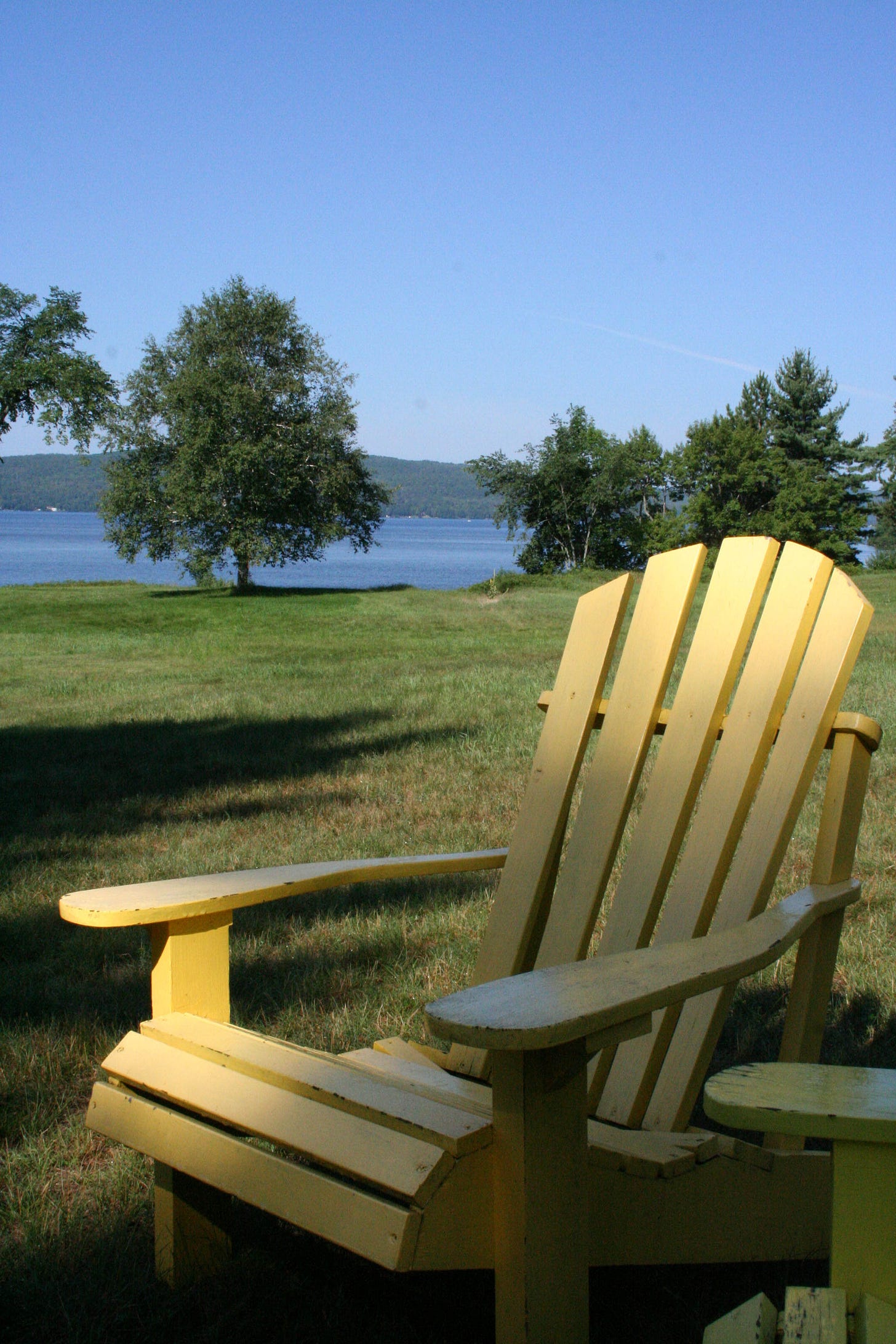 Muskoka chair by a lake