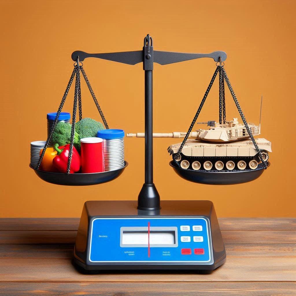 a scale with a battle tank in one pan and consumer goods in the other