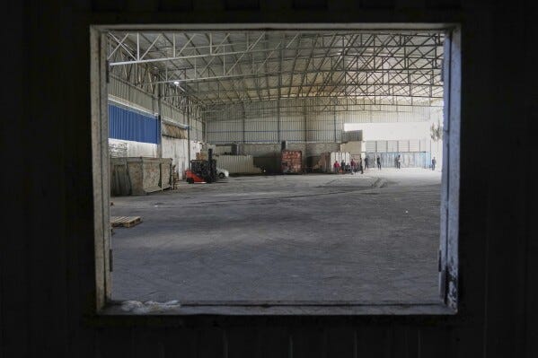 A World Food Program warehouse is seen empty in the Nuseirat refugee camp, Gaza Strip, Saturday April 26, 2025. (AP Photo/Abdel Kareem Hana)